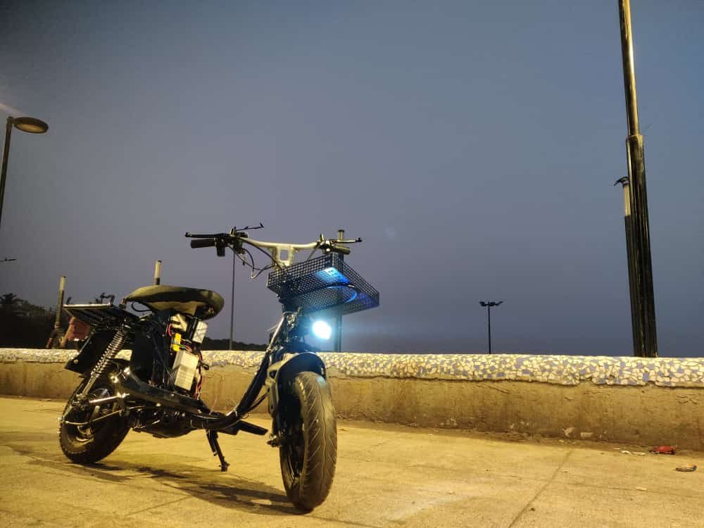 Prototype scooter at night with headlight on