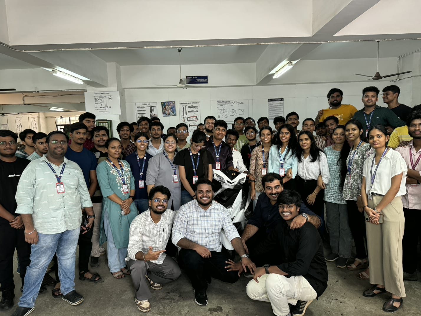 Workshop session with students and a scooter